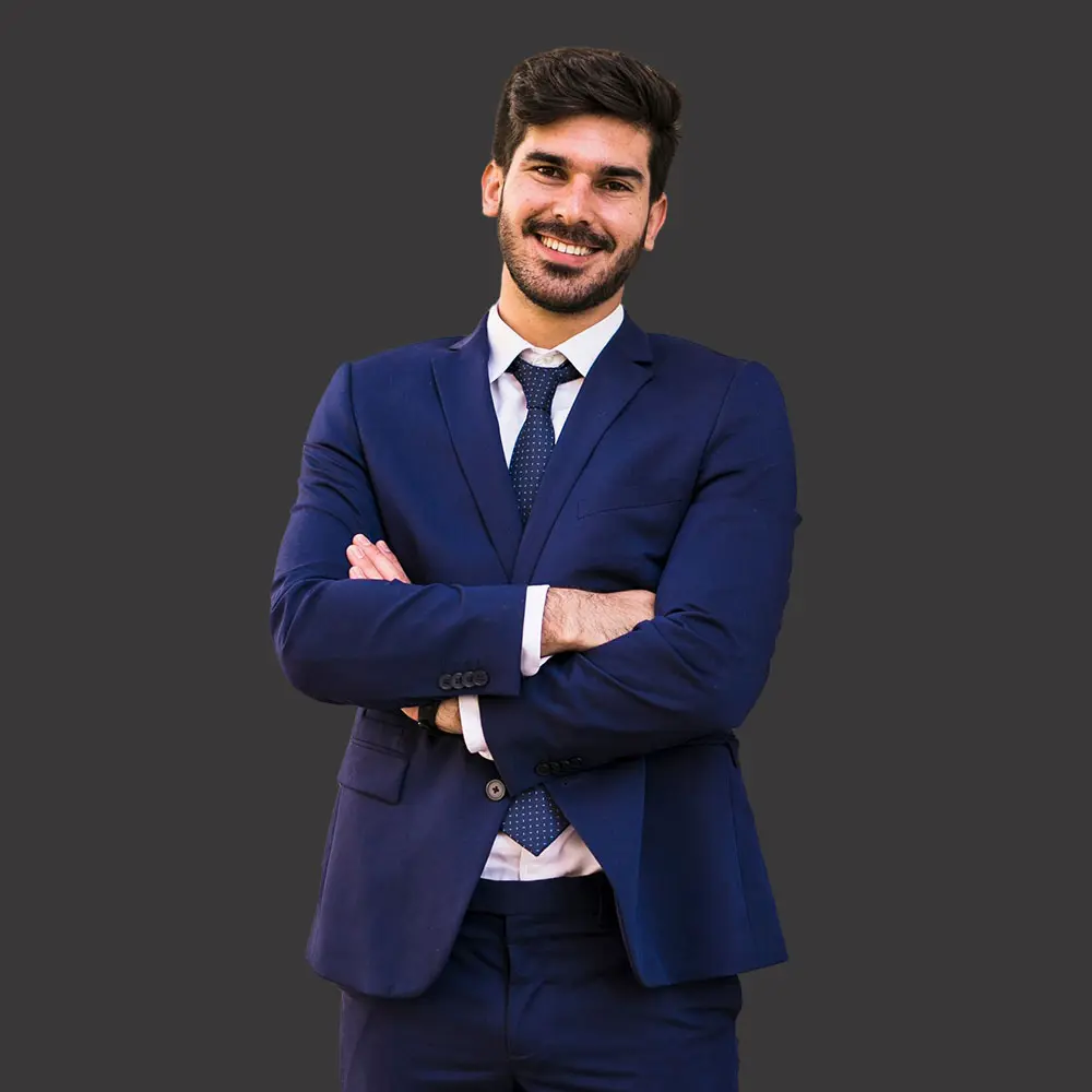 Professional marketing head in a navy blue suit, smiling confidently with folded arms on a dark background – ASA Web Solutions.
